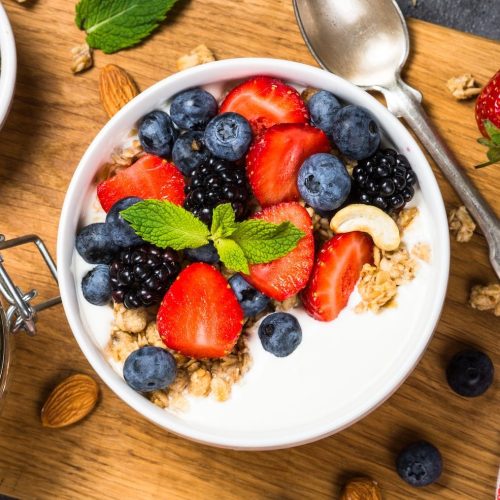 greek-yogurt-granola-with-fresh-berries-e1664470850475.jpg